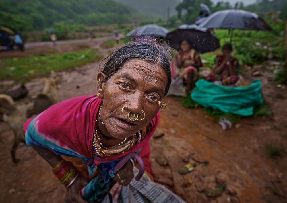 Tribal Woman in Odisha at a Rural Market Close-up portrait of a tribal woman in traditional jewellery and clothing in Odisha